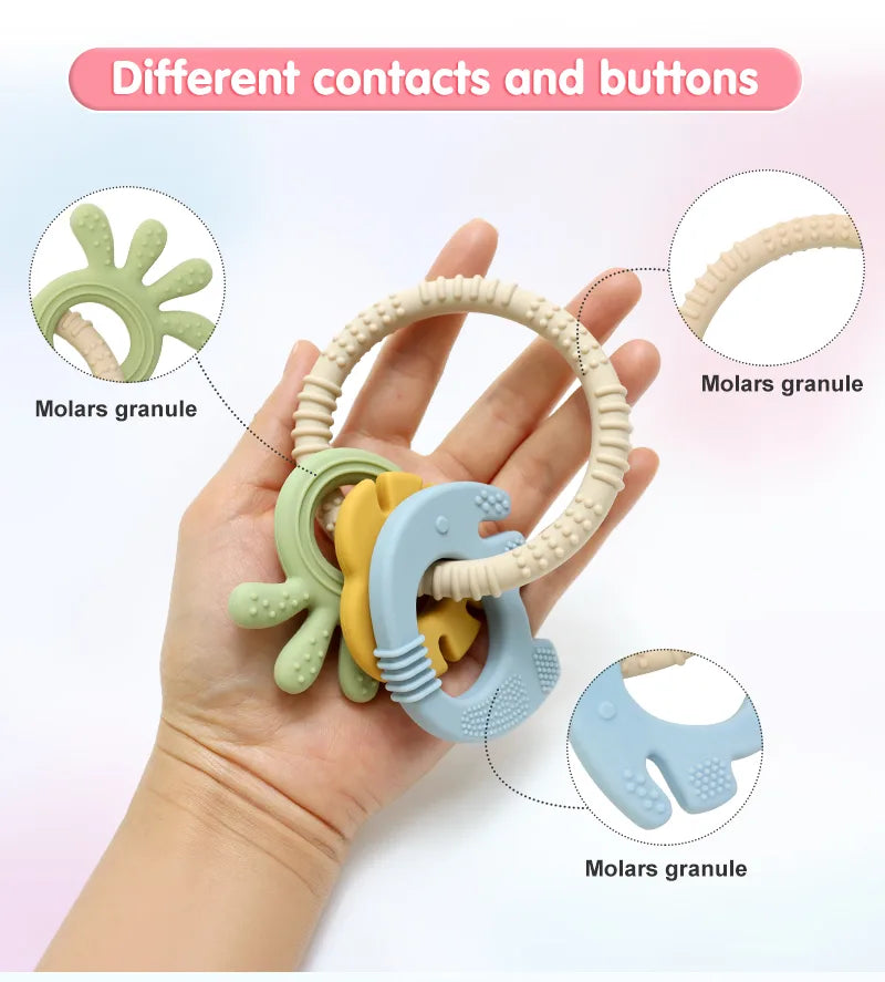 Tipi Tipi Tap 4 in 1 silicone baby teether ring set held in a hand with close-up details on molar granules.