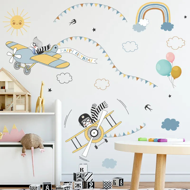 Children's room with airplane and zebra wall decals, balloons, and a toy house.