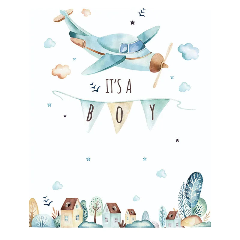 Illustration of a blue airplane with 'It's a Boy' banner over a village scene.