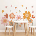 Children's table and chairs with Tipi Tipi Tap Boho Retro Colorful Flower Wall Decals on a light pink wall.