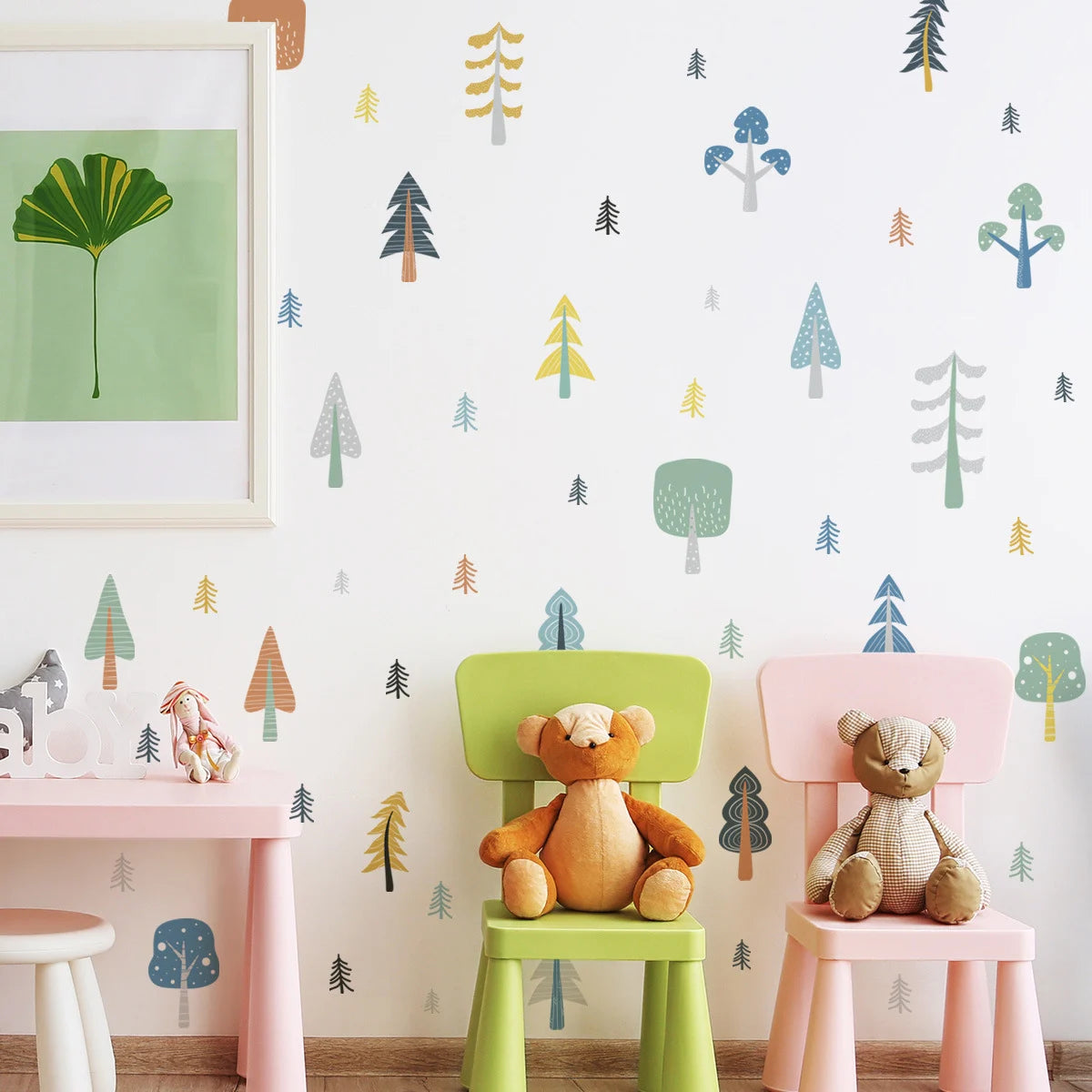 Children's room with colorful chairs, teddy bears, and a forest-themed wall.