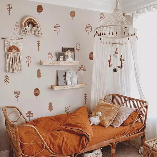 Nursery room with wicker crib, Tipi Tipi Tap Boho Art Tree Wall Stickers, and canopy.