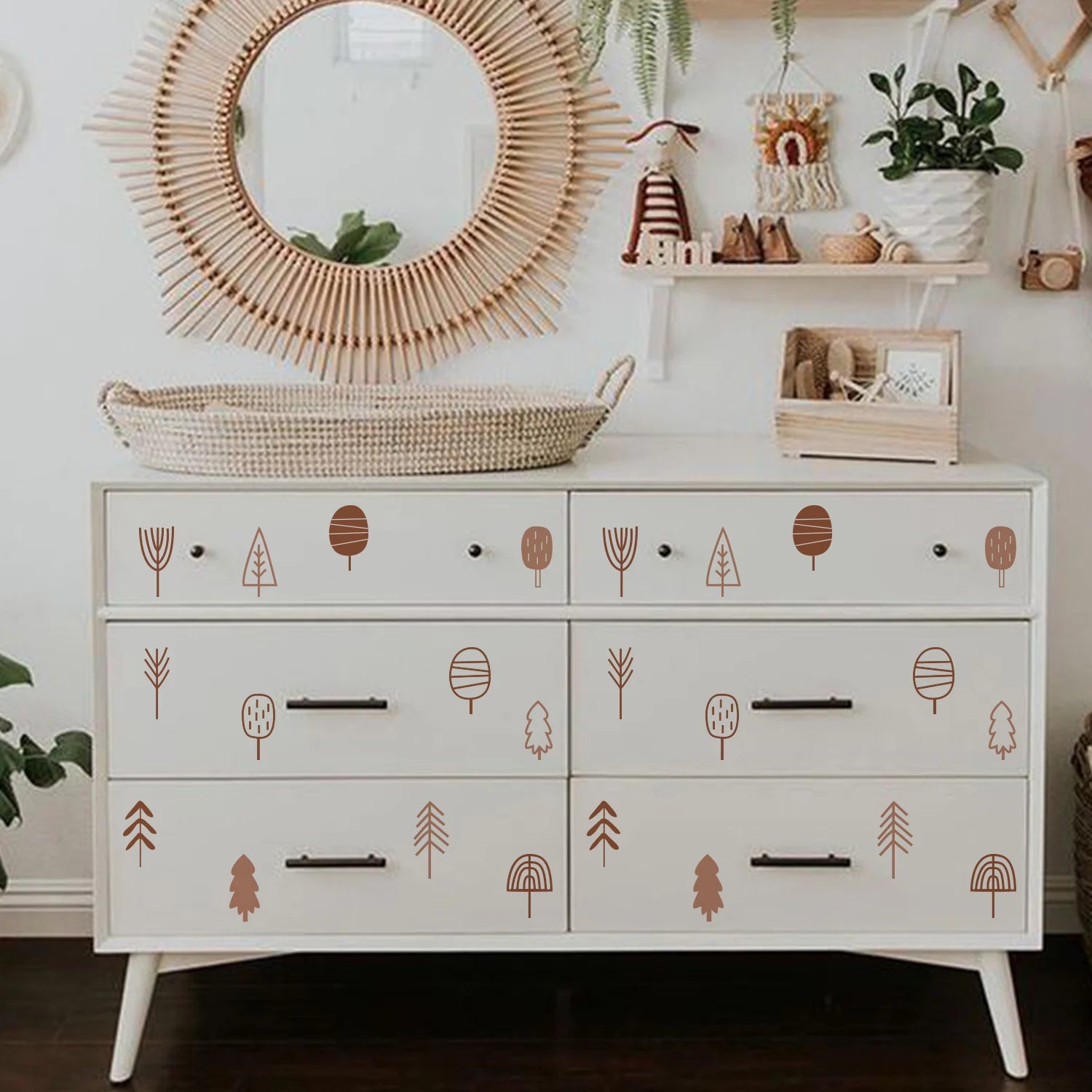 White dresser with Tipi Tipi Tap boho tree stickers in a room with a mirror and shelves.