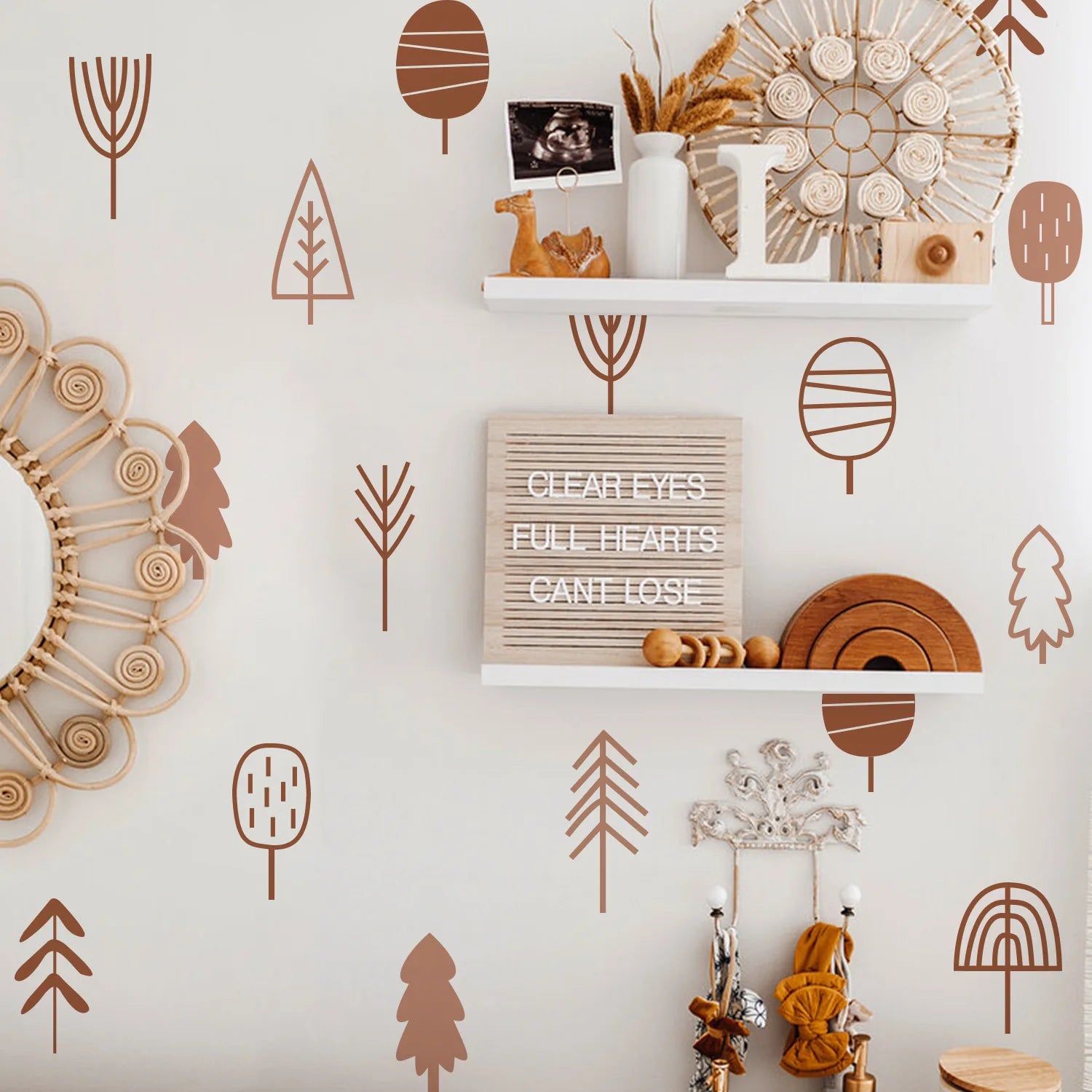 Decorative wall with Tipi Tipi Tap Boho Art Tree Wall Stickers, geometric patterns, shelves, and decorative items.