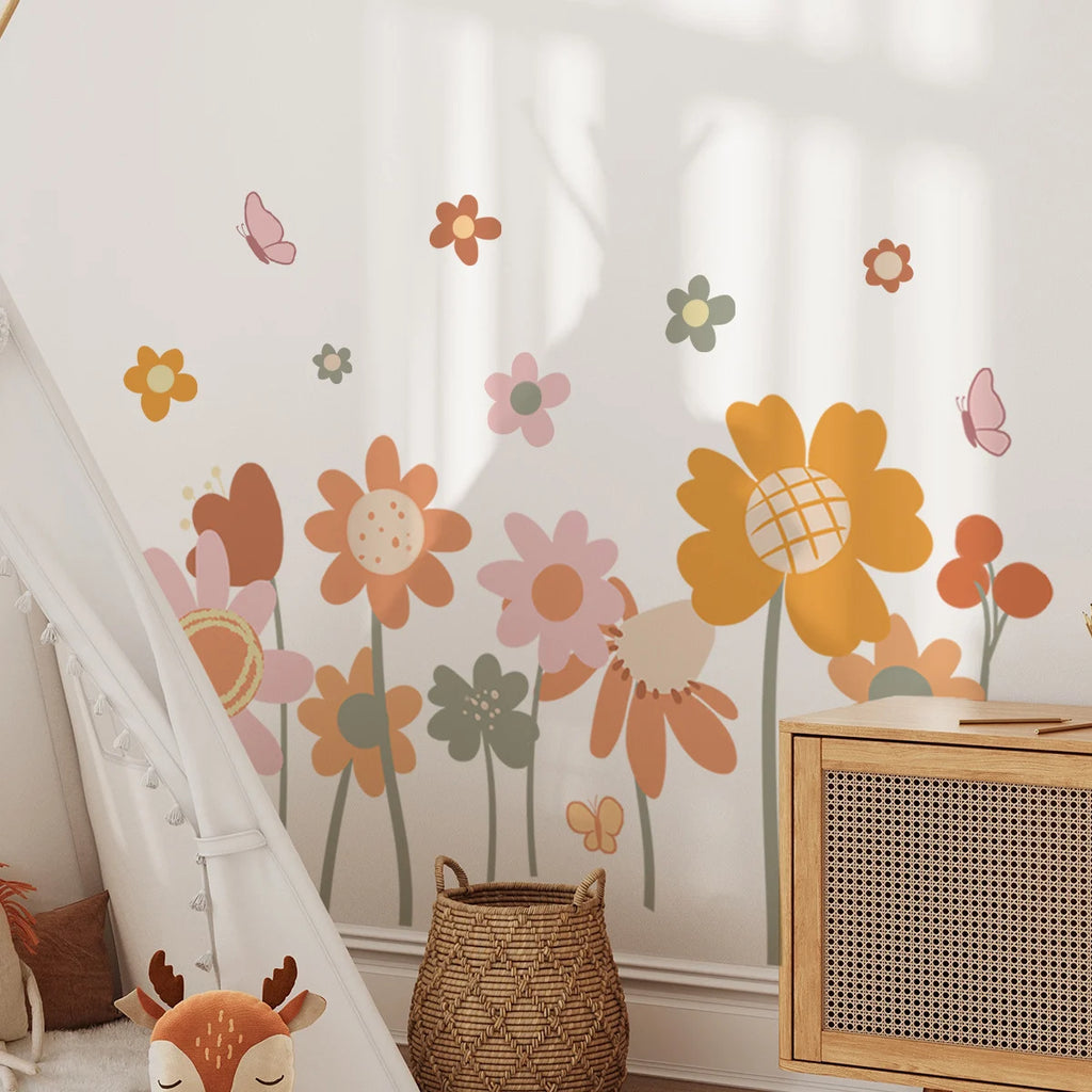 Children's room with Tipi Tipi Tap floral wall stickers and a wooden cabinet.