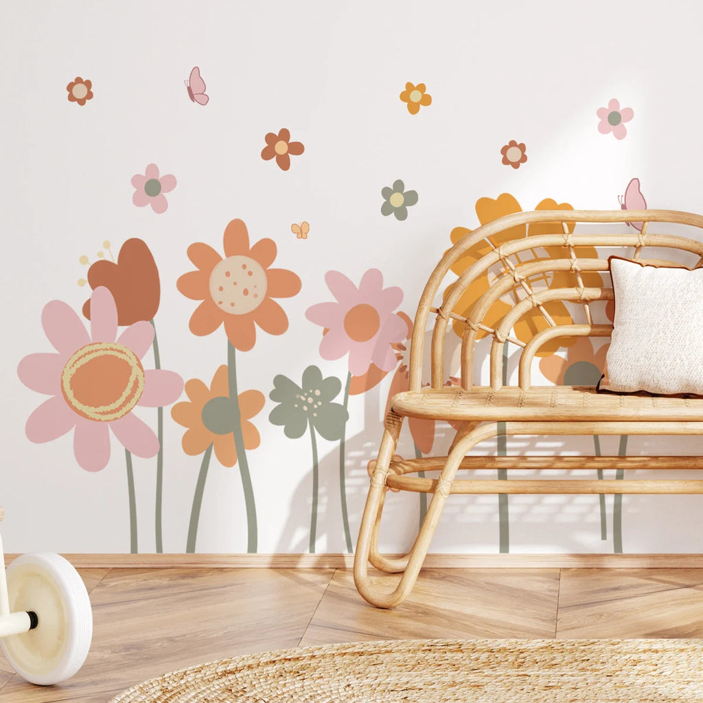 Wicker chair with a decorative pillow against a wall with Tipi Tipi Tap Boho Retro Colorful Flower wall sticker.
