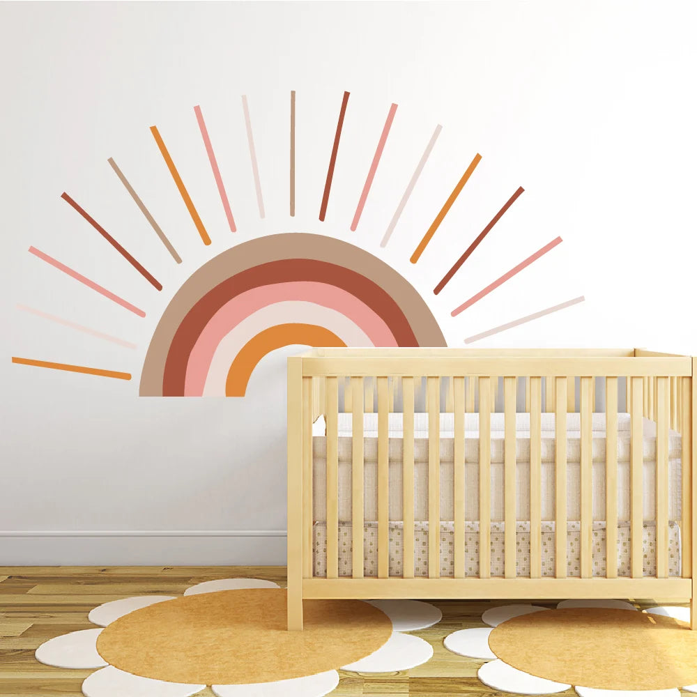 Nursery room with a wooden crib and colorful Tipi Tipi Tap sun wall sticker.