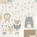 Children's wall stickers of animals on a light-colored wall with decorative elements.
