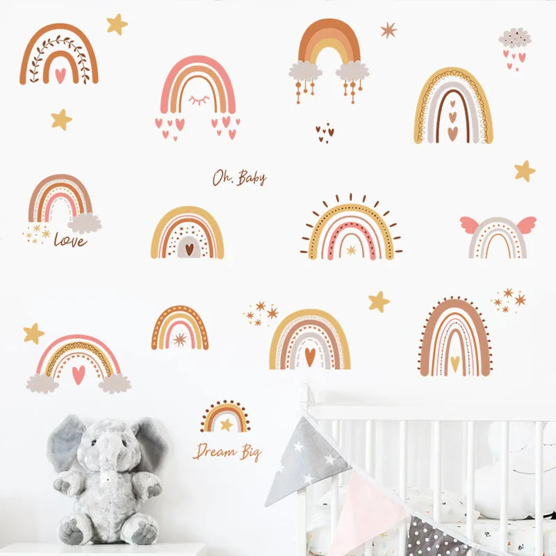 Wall with colorful rainbow decals in a nursery setting with a crib and stuffed elephant.