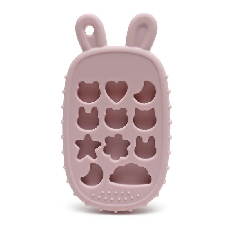 Pink Tipi Tipi Tap bunny calculator silicone teether without buttons with hollow animal and star shapes on a white background