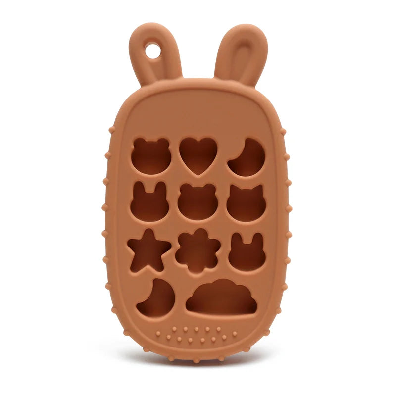 Brown Tipi Tipi Tap bunny calculator silicone teether without buttons with hollow animal and star shapes on a white background
