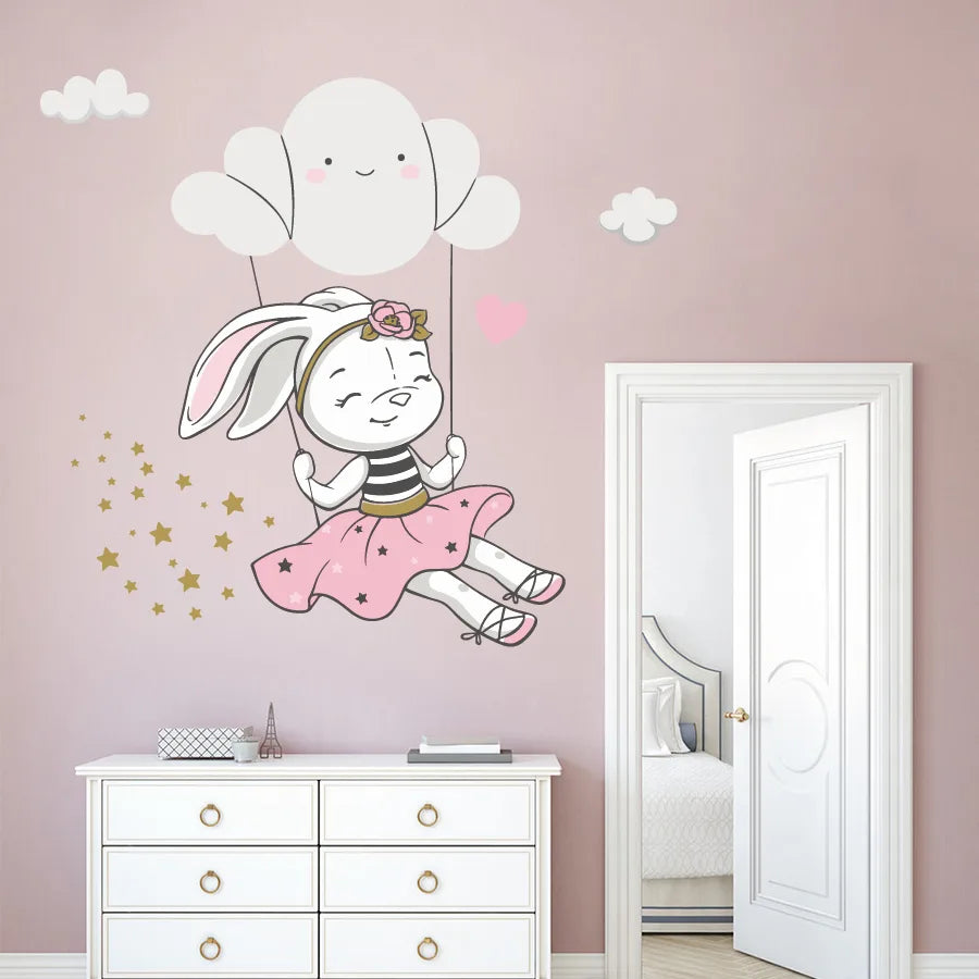 Tipi Tipi Tap Cute Bunny Swing On Cloud wall decal on a pink wall above a white dresser.