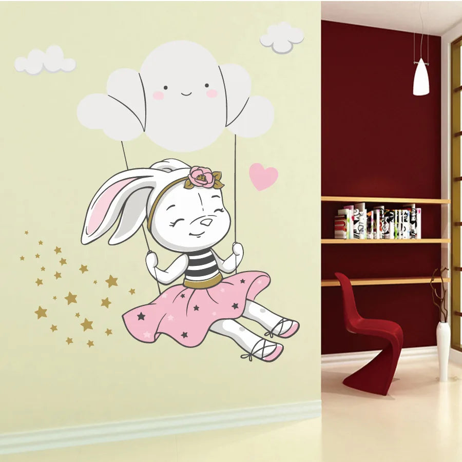 Tipi Tipi Tap Cute Bunny Swing On Cloud wall decal on a wall next to a bookshelf.