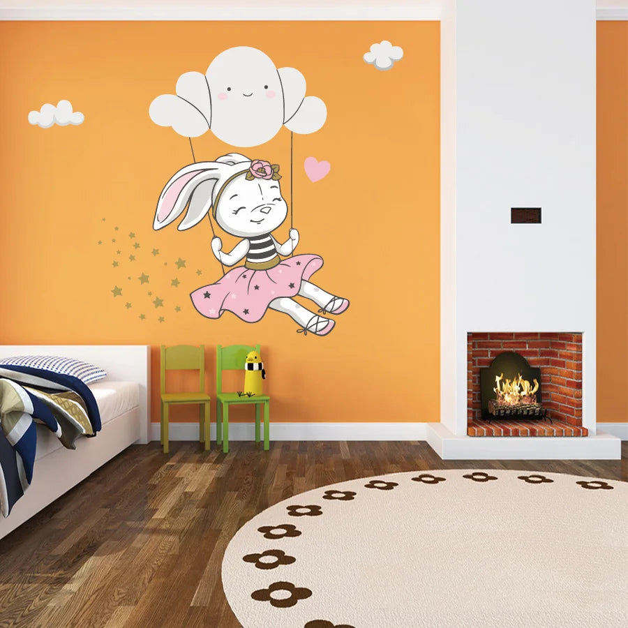 Children's room with a chair, bed and Tipi Tipi Tap Cute Bunny Swing On Cloud Wall decal on an orange wall.