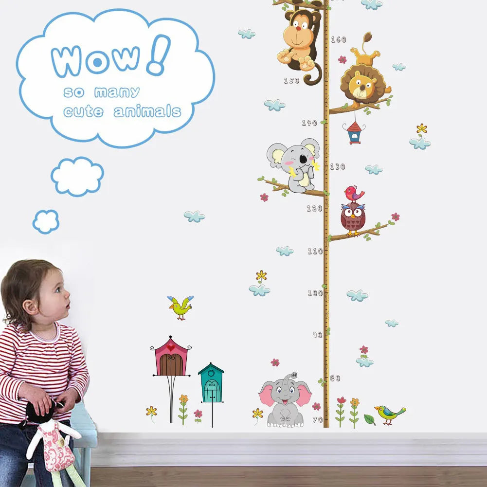 Child looking at a height chart with animal illustrations on a wall.