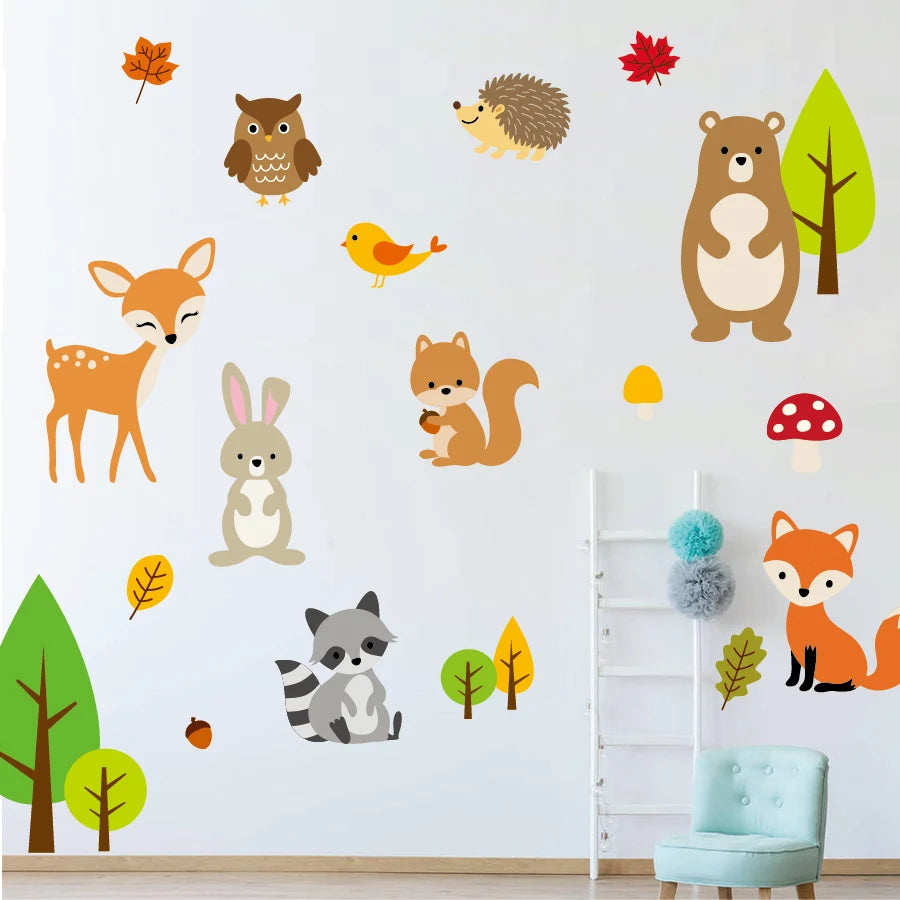 Woodland animal wall decals on a white wall with a chair and ladder in the foreground.