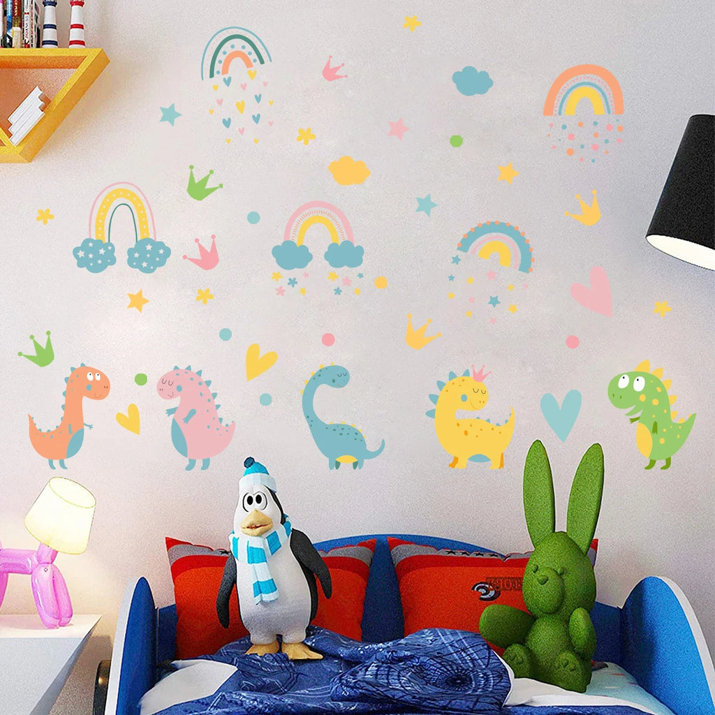 Children's room with Tipi Tipi Tap Dinosaur & Rainbow Wall Decal on a light gray wall and bed with toys.