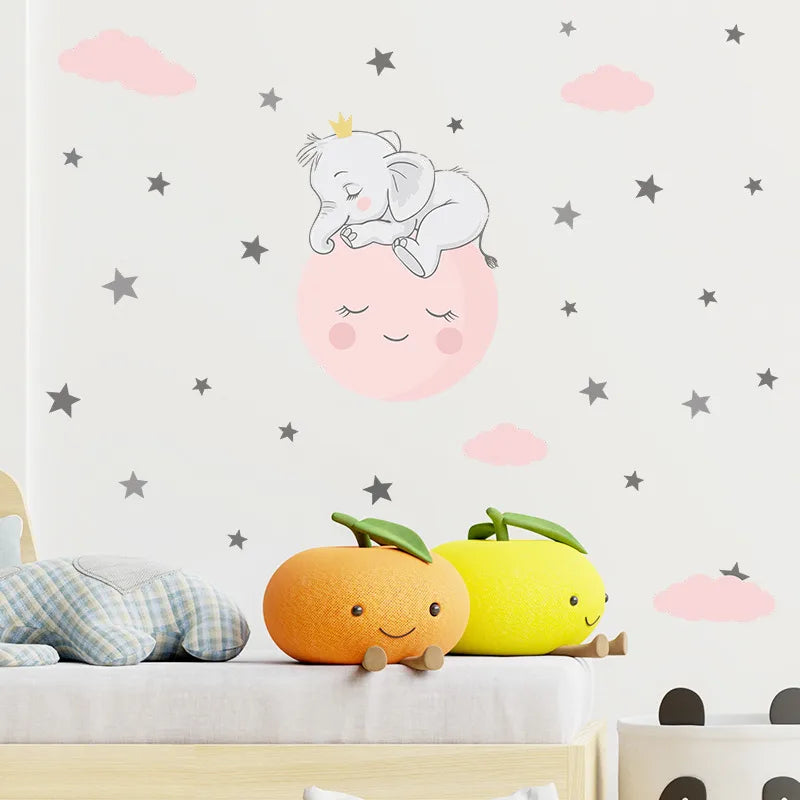 Children's room with wall decal of a sleeping elephant, smiling moon, and stars.