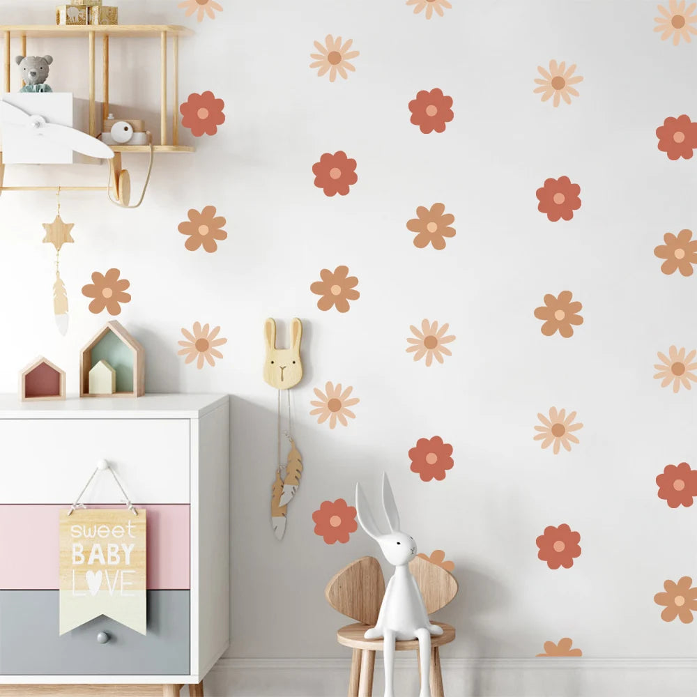 Children's room with floral wall decals, a white cabinet, and decorative items.