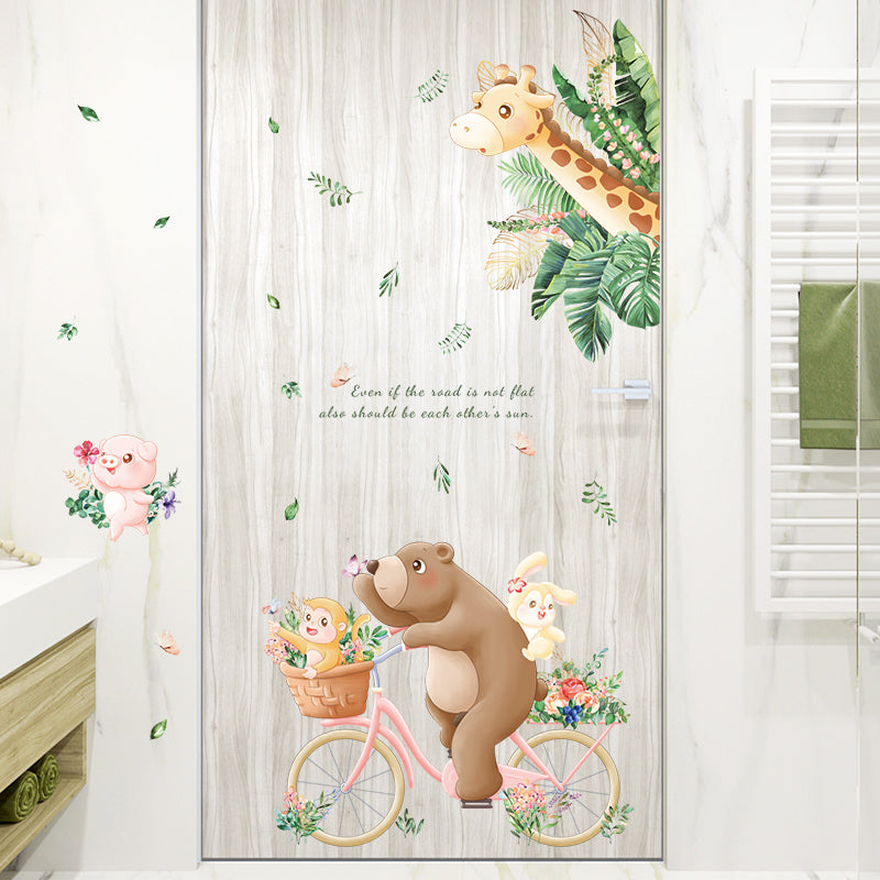 Decorative door with cartoon animals on a bicycle and flowers, featuring a giraffe, bear, and monkey.