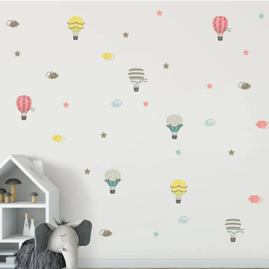 Wall with colorful Tipi Tipi Tap Hot Air Balloon & Cloud wall decals in a child's room.
