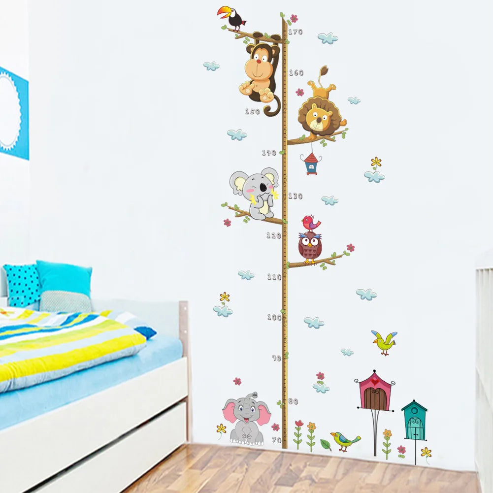 Children's room with a growth chart featuring cartoon animals on the wall.