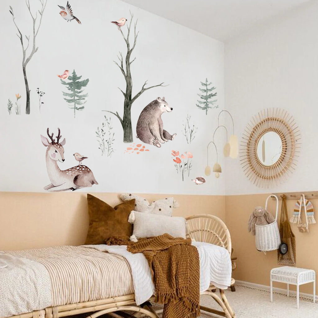 Children's bedroom with wall decals of animals and nature, wicker furniture, and decorative elements.