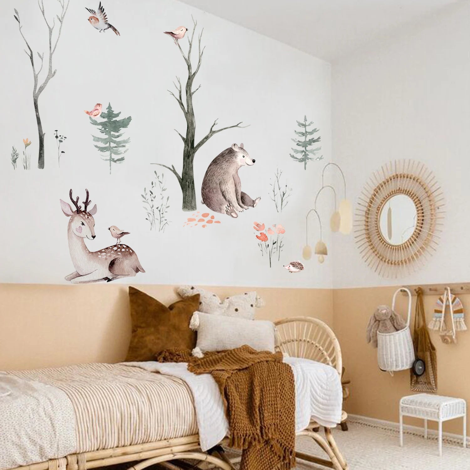 Children's bedroom with wall decals of animals and nature, wicker furniture, and decorative elements.