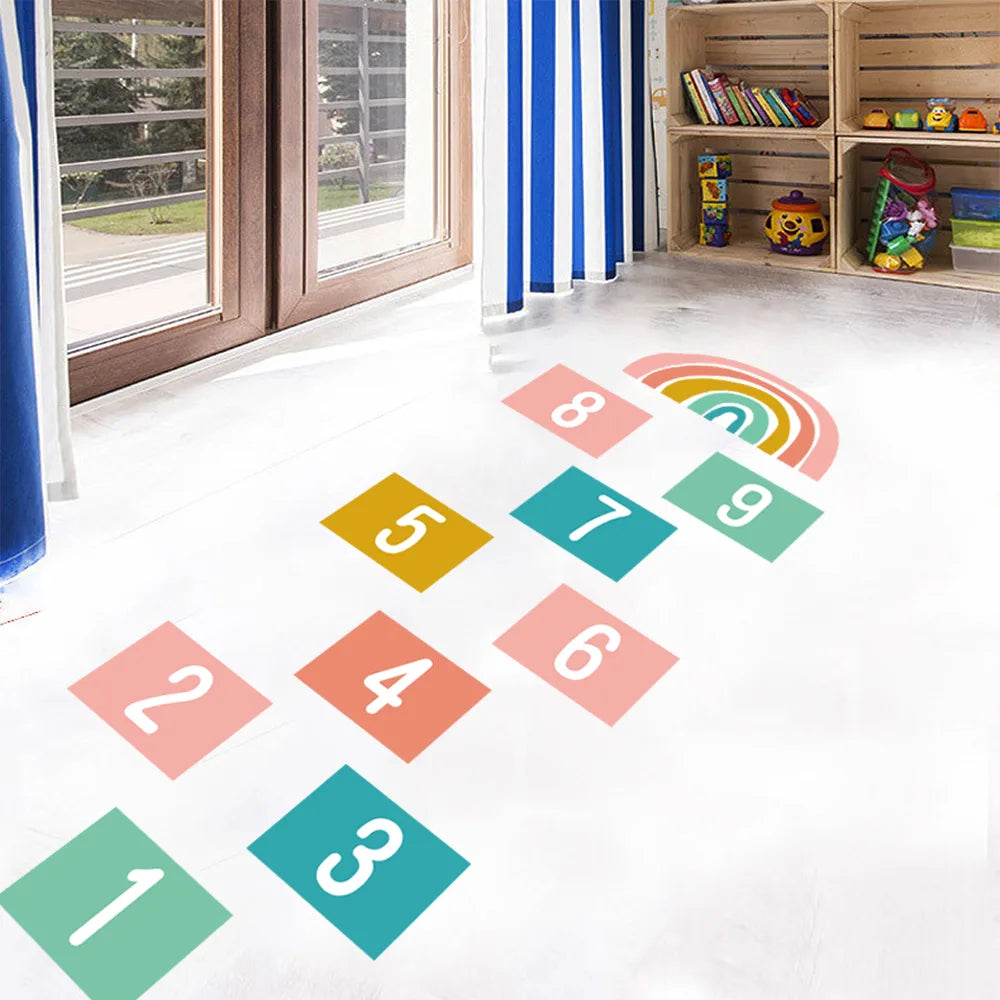 Pumkins Colorful hopscotch grid on a white floor with toys in the background