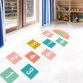Pumkins Colorful hopscotch grid on a white floor with toys in the background