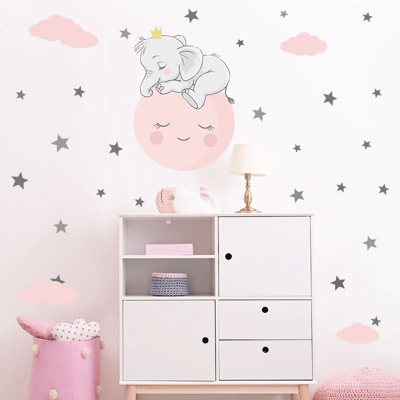 Children's room with decorative wall stickers of a sleeping baby elephant and stars.