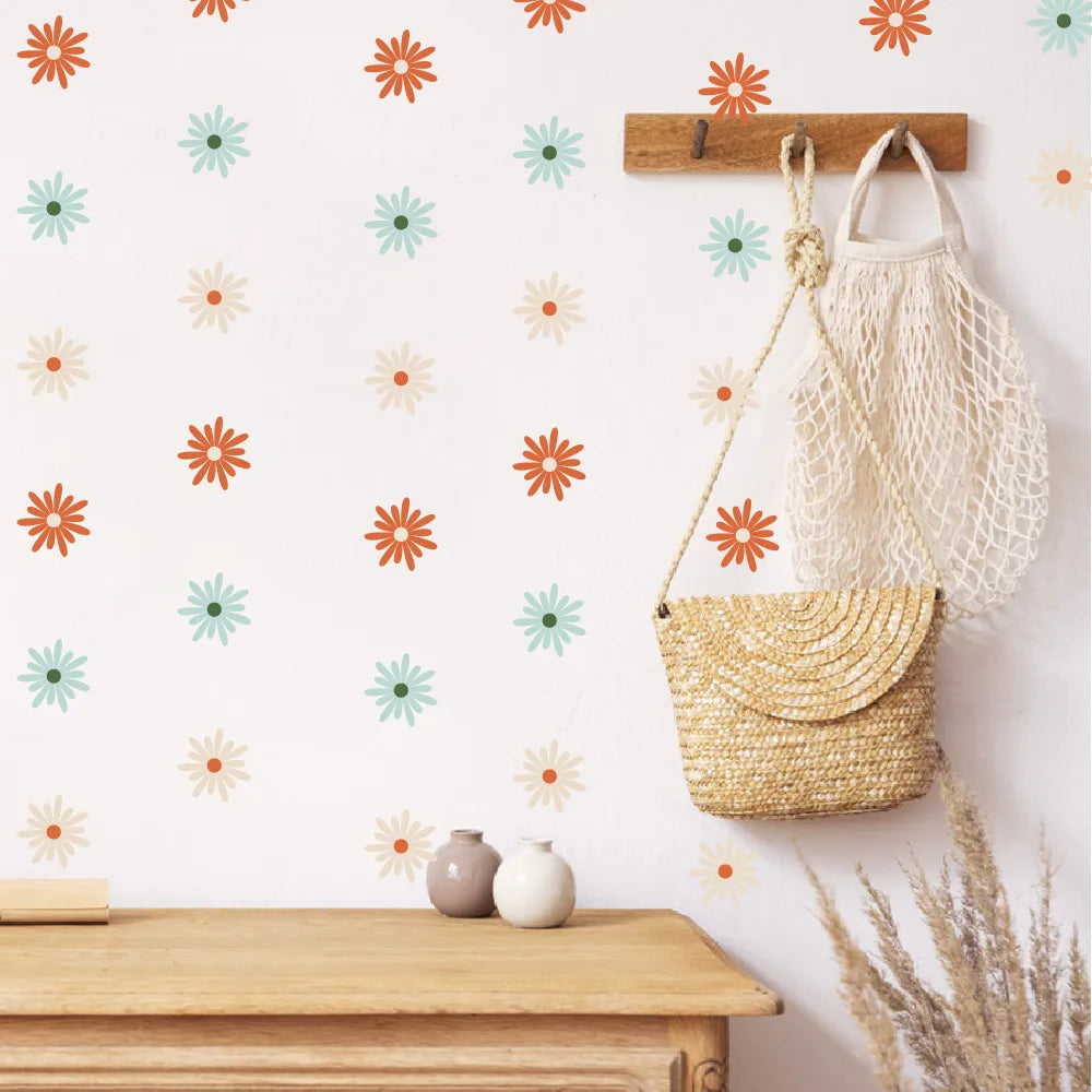 Wall with Pumkins floral pattern, wooden hook, and bags on a white wall.