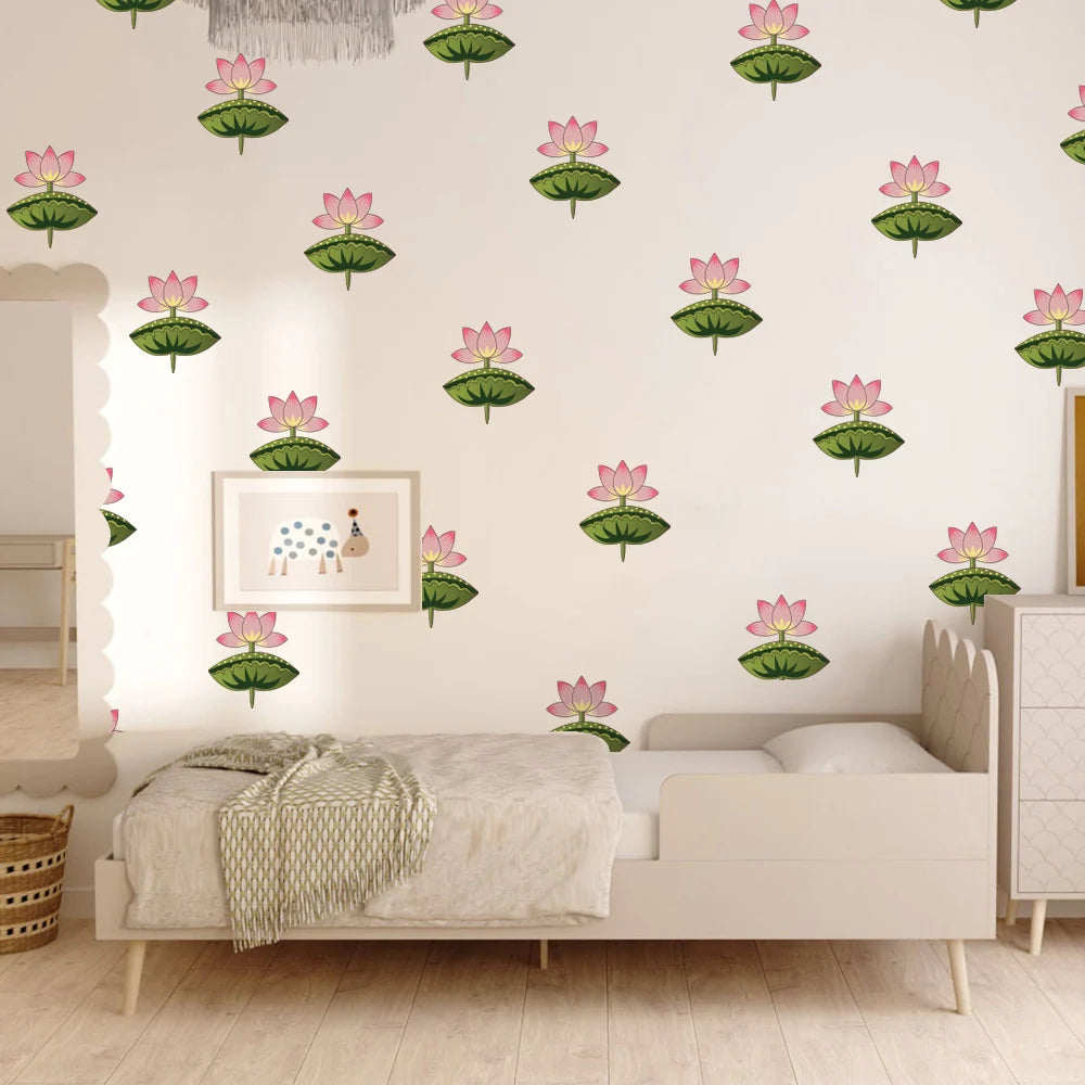 A nursery room scene with a bed, dresser, and wall covered in repeating Tipi Tipi Tap Pink Lotus Flower Wall Stickers on a white wall.