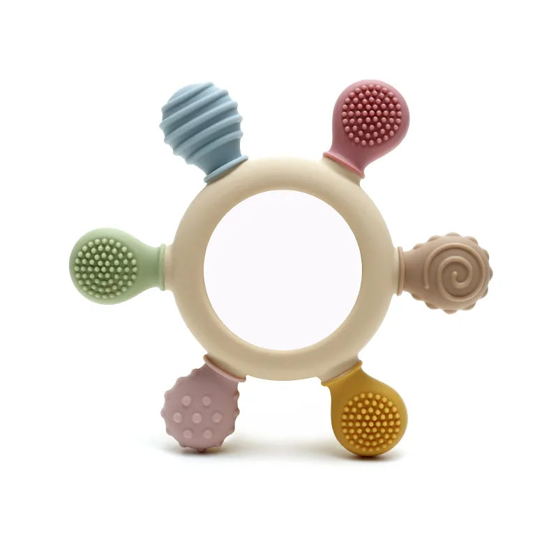 Colorful Tipi Tipi Tap Rainbow Ring Silicone Baby Teether with various textured surfaces on a white background