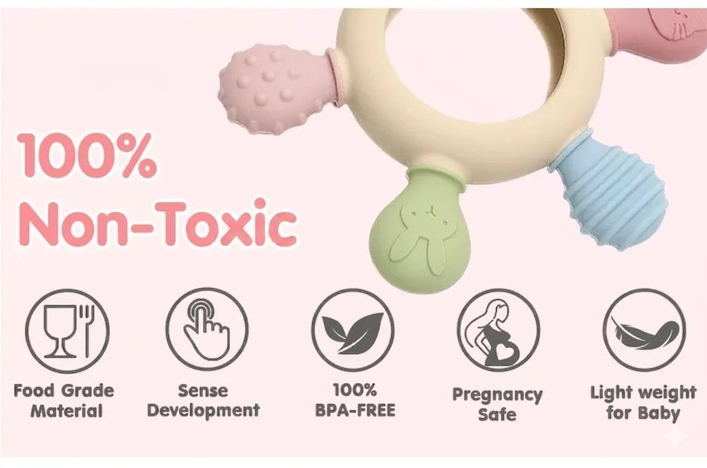 Tipi Tipi Tap Rainbow Ring Silicone Baby teether with safety features and '100% Non-Toxic' text on a pink background