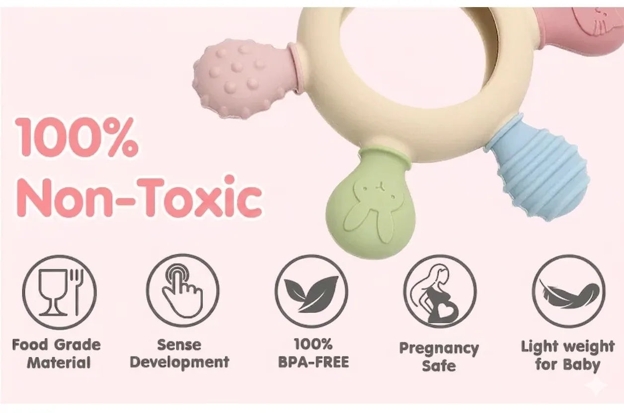 Tipi Tipi Tap Rainbow Ring Silicone Baby teether with safety features and '100% Non-Toxic' text on a pink background