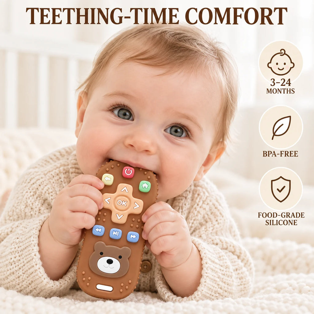 A baby in a cream knit sweater holds Tipi Tipi Tap Silicone Baby Remote Teether shaped like a brown bear remote control. The image includes the text 'TEETHING-TIME COMFORT' and three circular icons noting '3-24 MONTHS', 'BPA-FREE', and 'FOOD-GRADE SILICONE'.