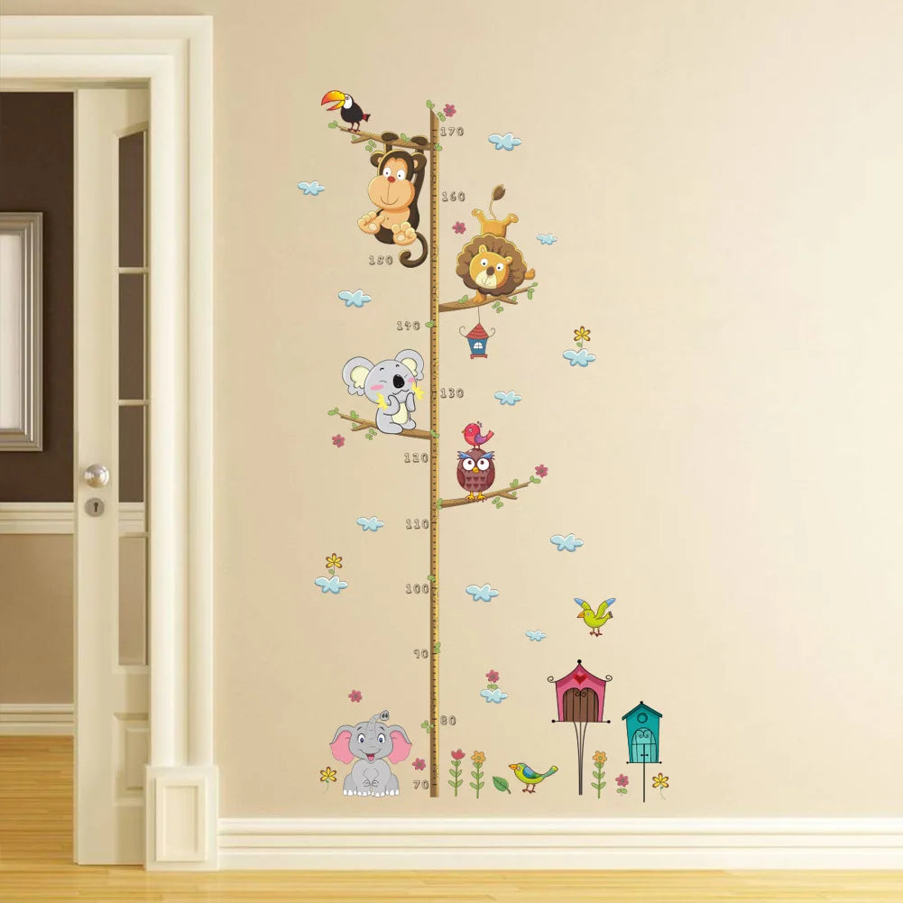 Children's growth chart with cartoon animal characters on a wall.