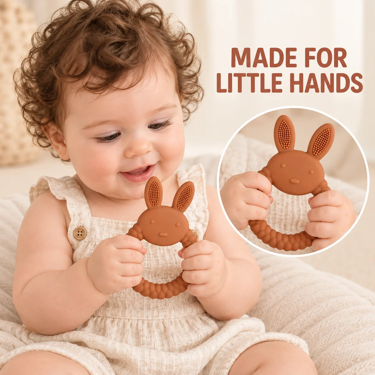 A baby in a cream-colored romper holds a brown Tipi Tipi Tap Rabbit Silicone Baby Teether. The image includes a circular inset showing a close-up of the baby's hands on the teether and the text 'MADE FOR LITTLE HANDS' in brown lettering.