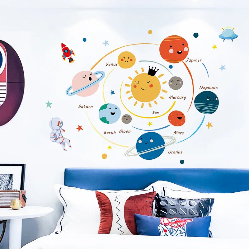 Children's room with Tipi Tipi Tap Smiling Solar System wall sticker and colorful pillows.