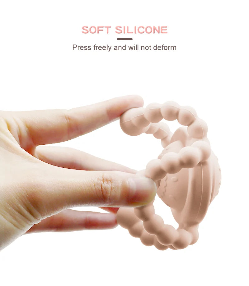 Hand holding a soft silicone Tipi Tipi Tap Triangular Rattle Teether with text indicating its flexibility.