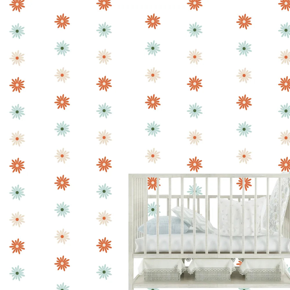 Children's room with a crib and colorful geometric wall decals.