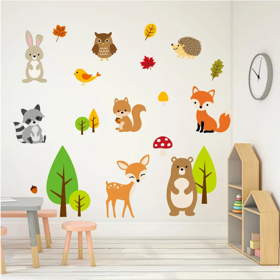 Woodland animal wall decals on a white wall with a clock and small wooden house.