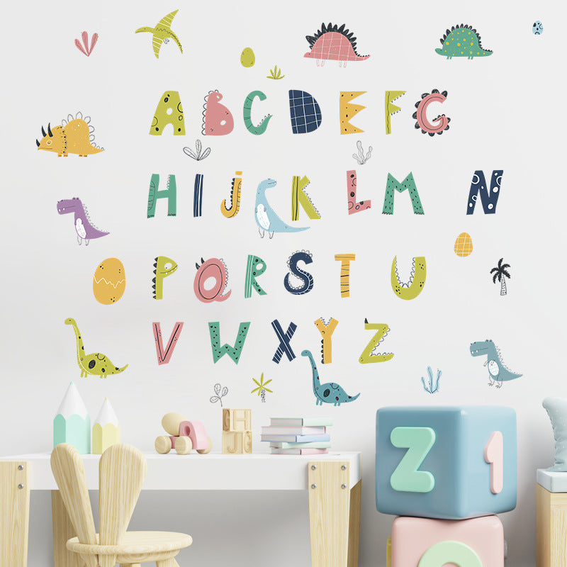 Children's room with Pumkins alphabet and dinosaur wall decals, toys, and a table.