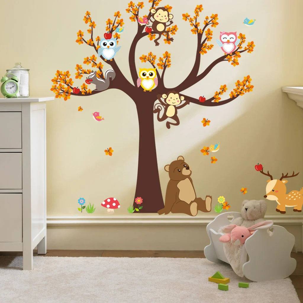 Children's room with Pumkins wall decals of a tree, animals, and toys.